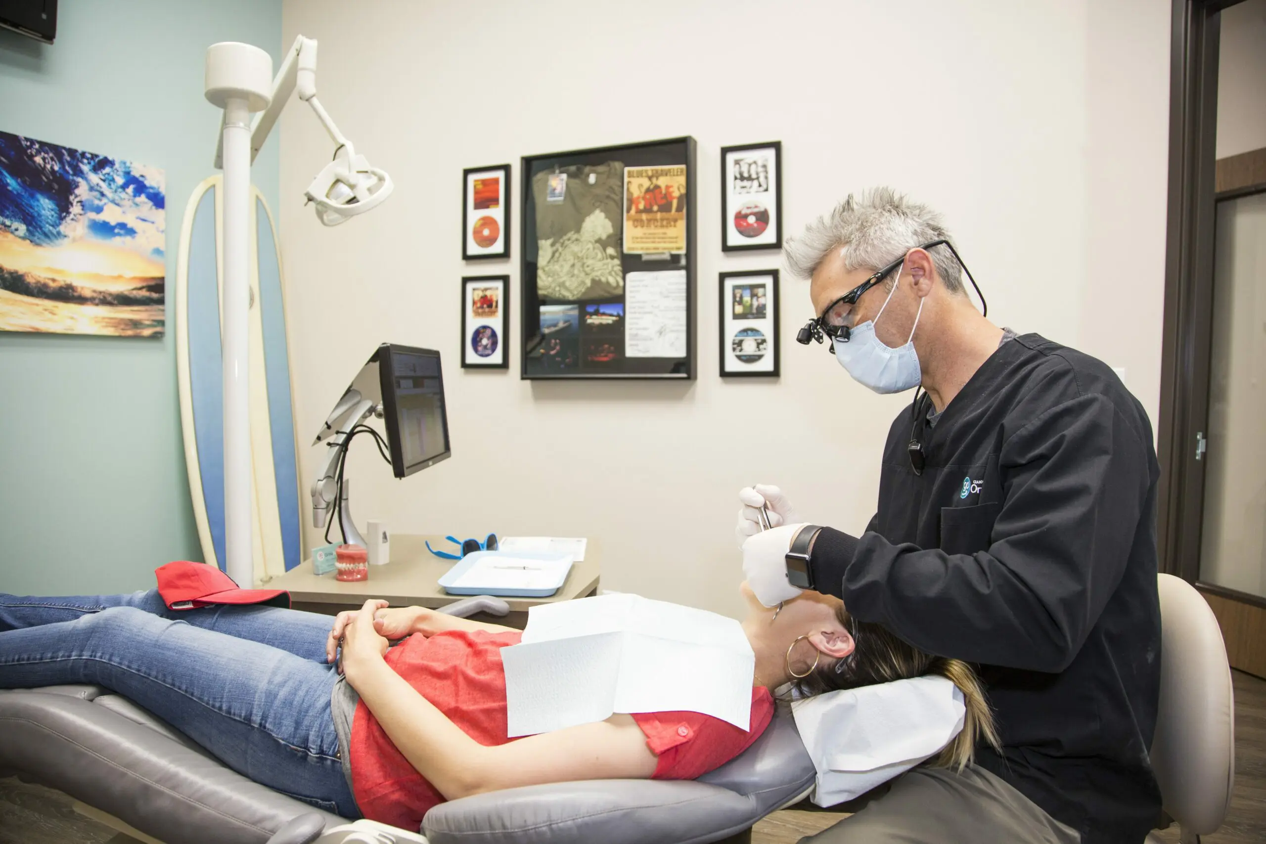 Dr. G at Gianquinto Orthodontic in Bakersfield, Tehachapi or Mammoth Lakes, CA, examines a patient in a clinic room with the best orthodontic appliances.