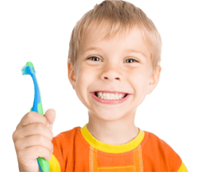 Boy holding toothbrush