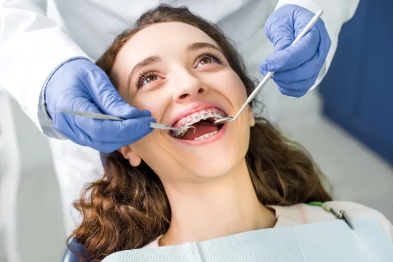 a woman being examined by an orthodontist after being explained about how long do braces take in bakersfield and tehachapi, ca