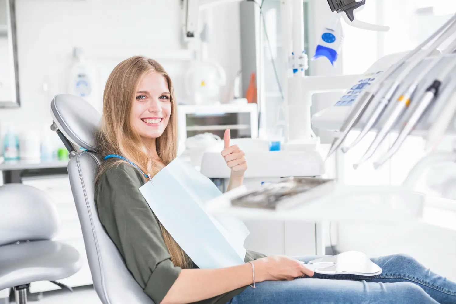 Woman smiles near orthodontic appliances at Gianquinto Orthodontic Arts in Mammoth Lakes, CA