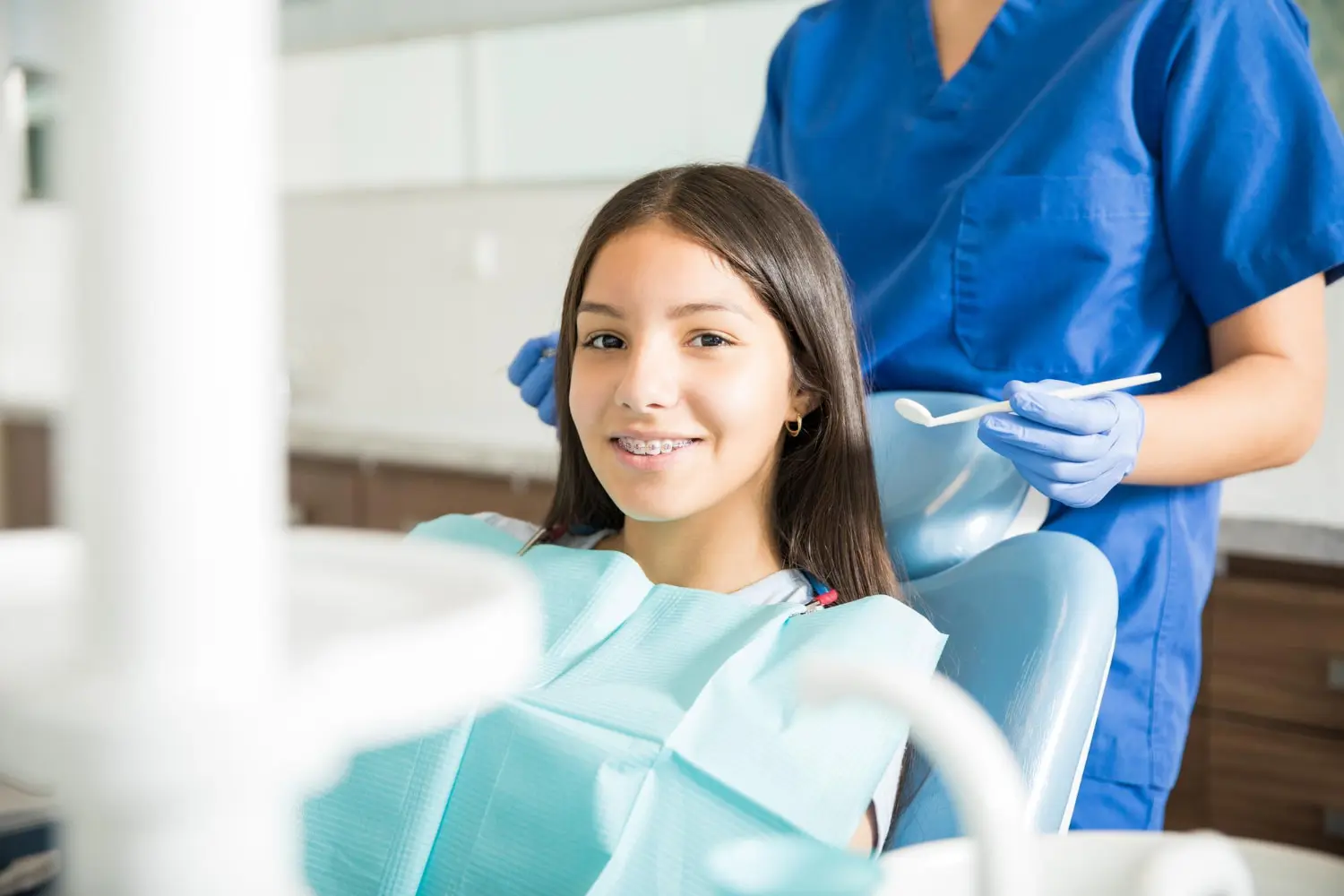 A girl with braces gets a free orthodontic consultation for braces at Gianquinto Orthodontic Arts in Bakersfield, CA