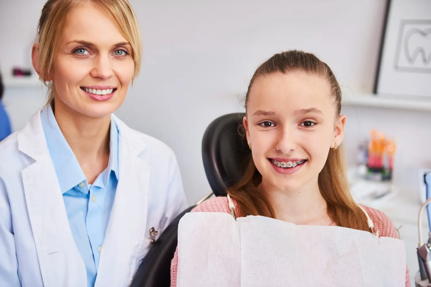 A dentist and teen during free orthodontic consultation for Braces at Gianquinto Orthodontic Arts in Tehachapi, CA