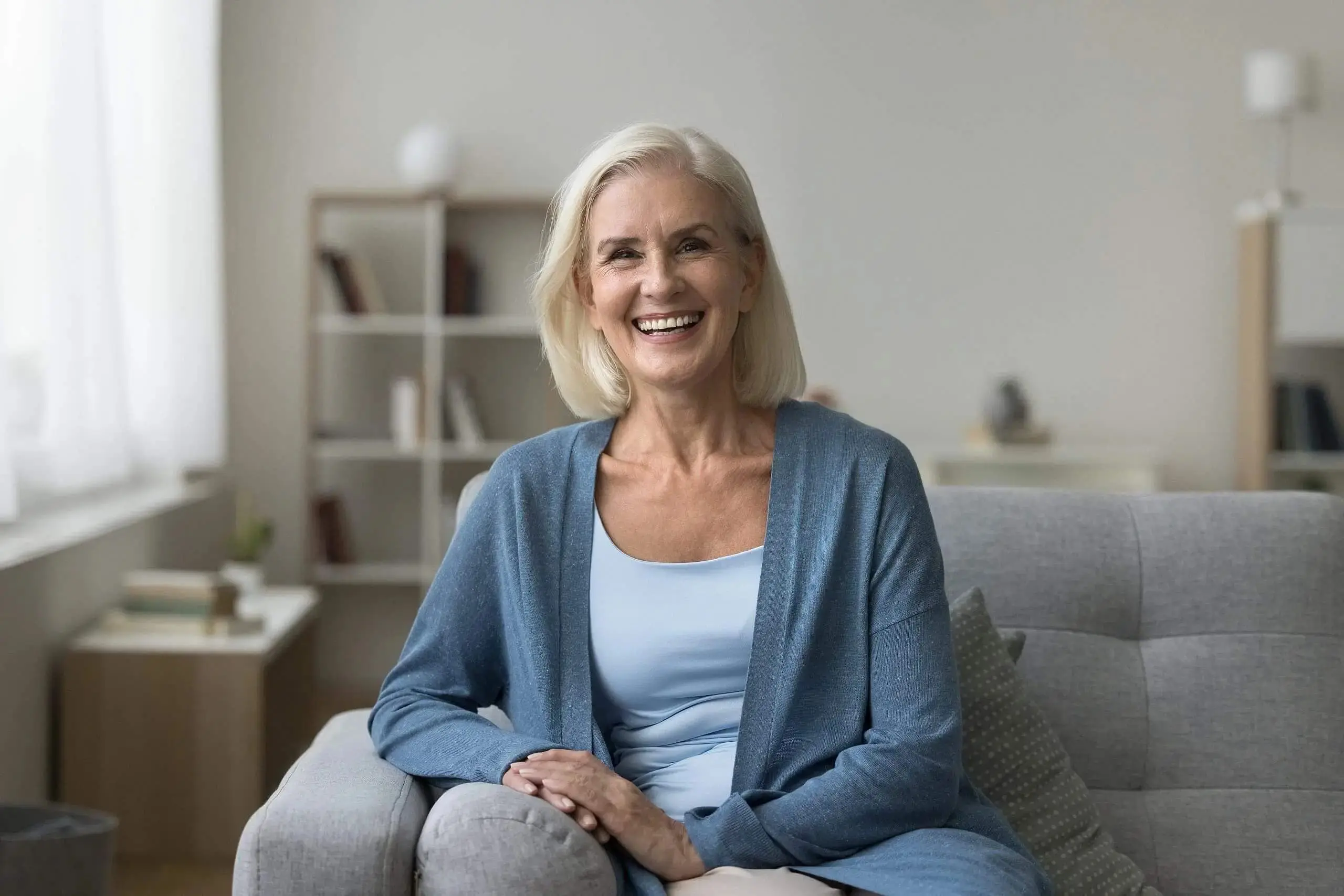 An older woman smiles confident with Orthodontic Insurance from Gianquinto Orthodontic Arts in Bakersfield, Tehachapi and Mammoth Lakes, CA.
