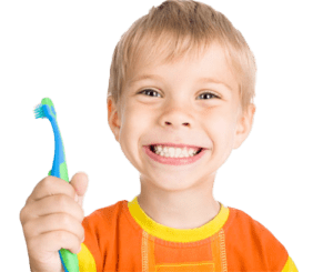 Boy holding toothbrush