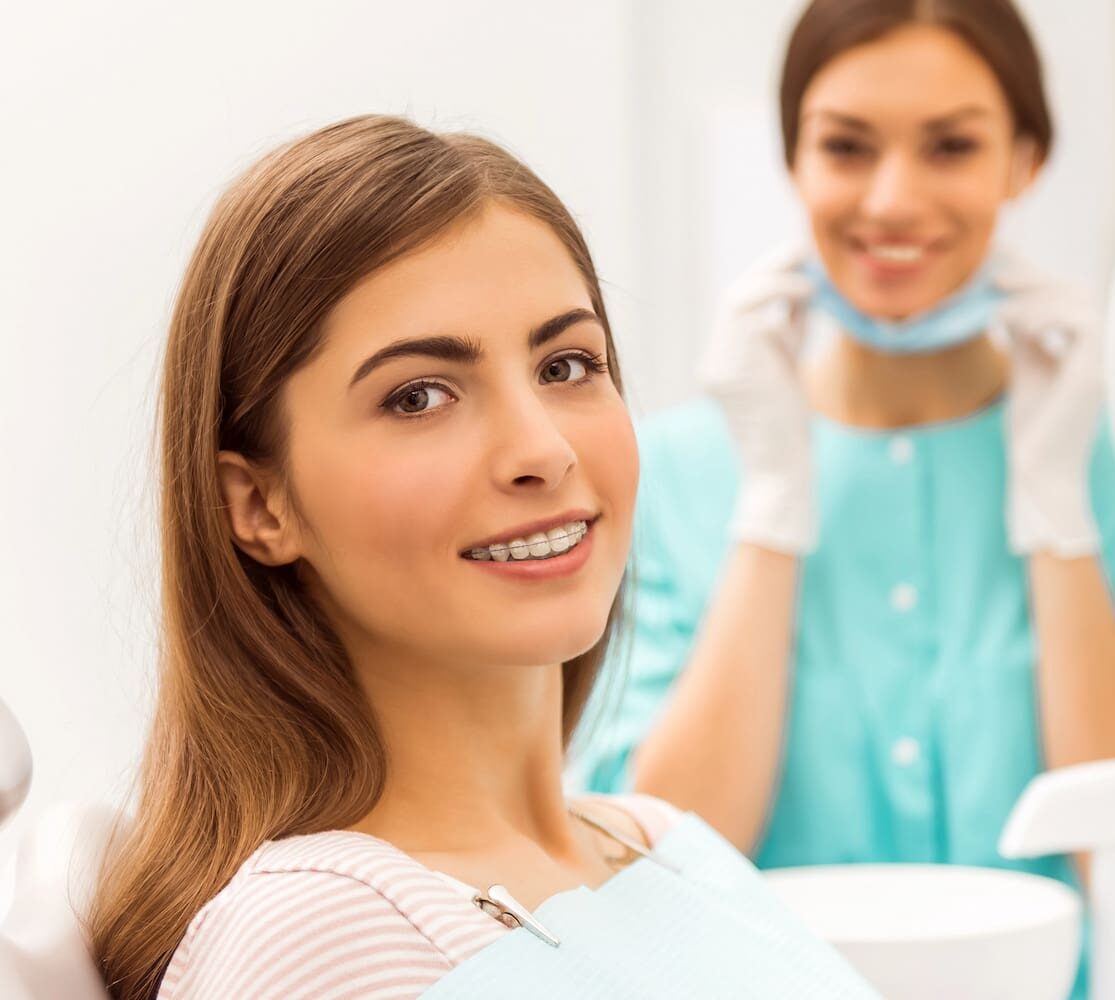 woman smiles, feel the benefits of Clear Braces from Gianquinto Orthodontic Arts in Bakersfield, Tehachapi, or Mammoth Lakes, CA