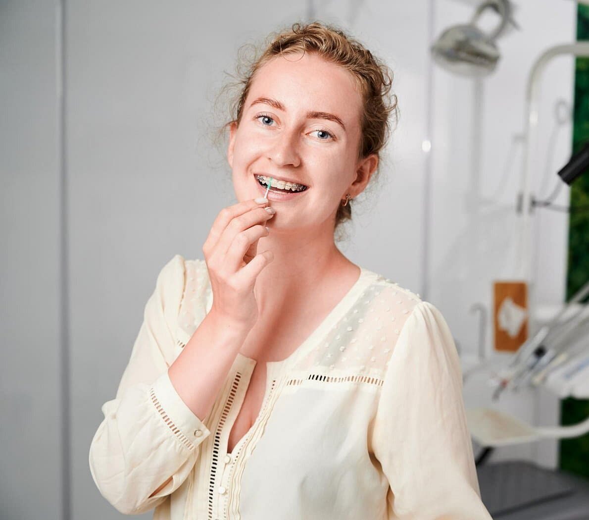 A woman with ceramic braces, promoting Gianquinto Orthodontic Arts in Bakersfield, Tehachapi or Mammoth Lakes, CA